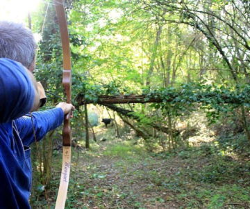 21 Tiro con larco nel bosco